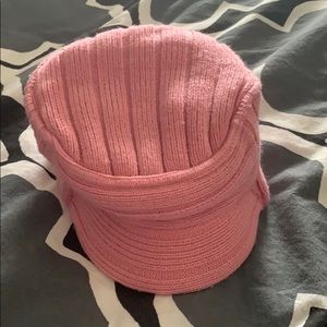 Infant pink hat knit with a small brim